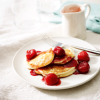 Ricotta pancakes with poached cherries
